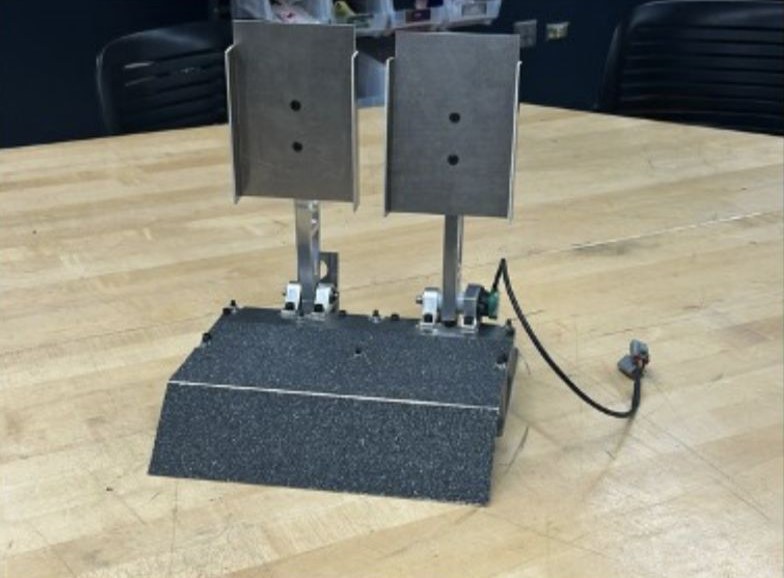 The finished pedal box assembly on a workshop table
